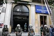 Marfin: Στην Αθήνα σήμερα η 46χρονη κατηγορούμενη που αρνείται κάθε εμπλοκή